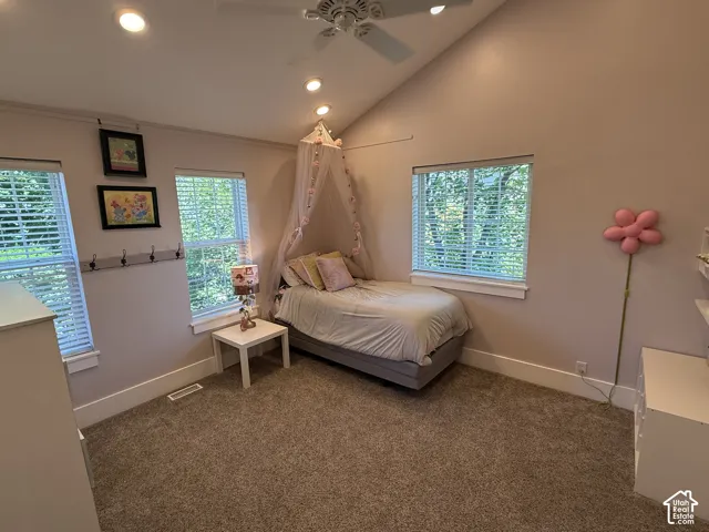 Bedroom #2, featuring vaulted ceilings  with recessed lighting.