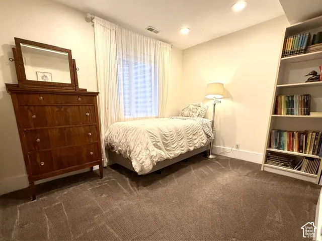 Bedroom #4 with recessed ceiling lighting.