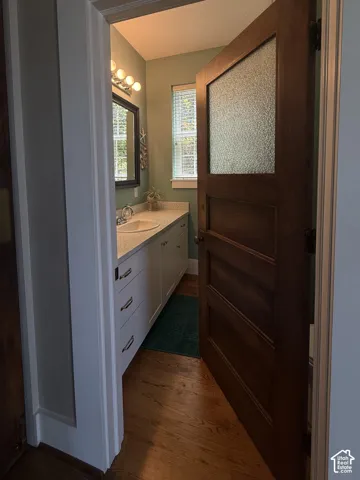 Main floor bathroom with a single vanity featuring an undermount sink and a light-toned countertop