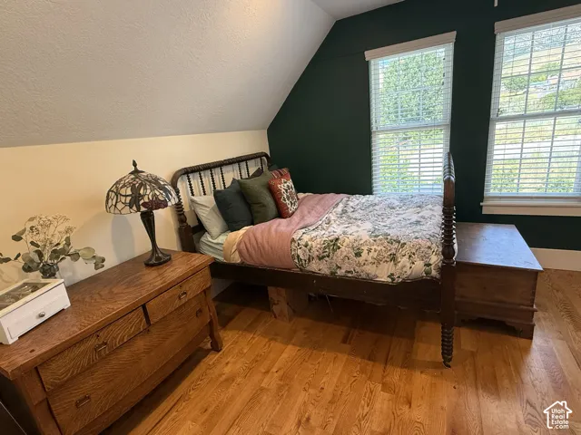 Bedroom #6 with hardwood flooring