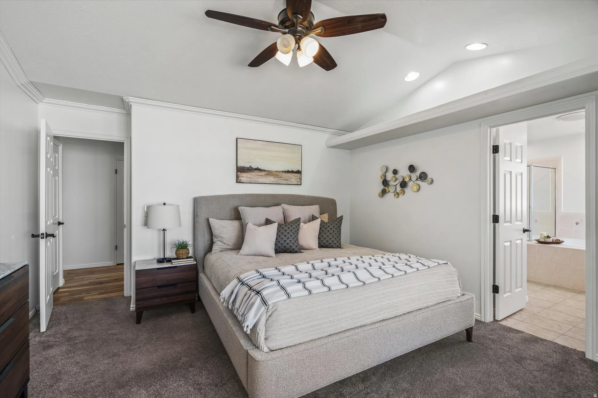 Primary Bedroom Vaulted ceiling room featuring a ceiling fan, recessed lighting, and crown molding