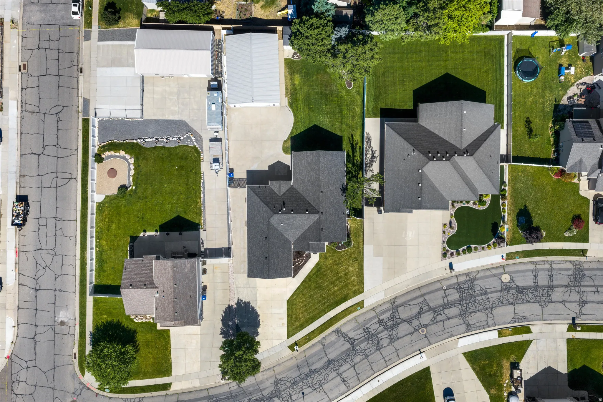 Aerial perspective showcasing parking yard and garage/shop
