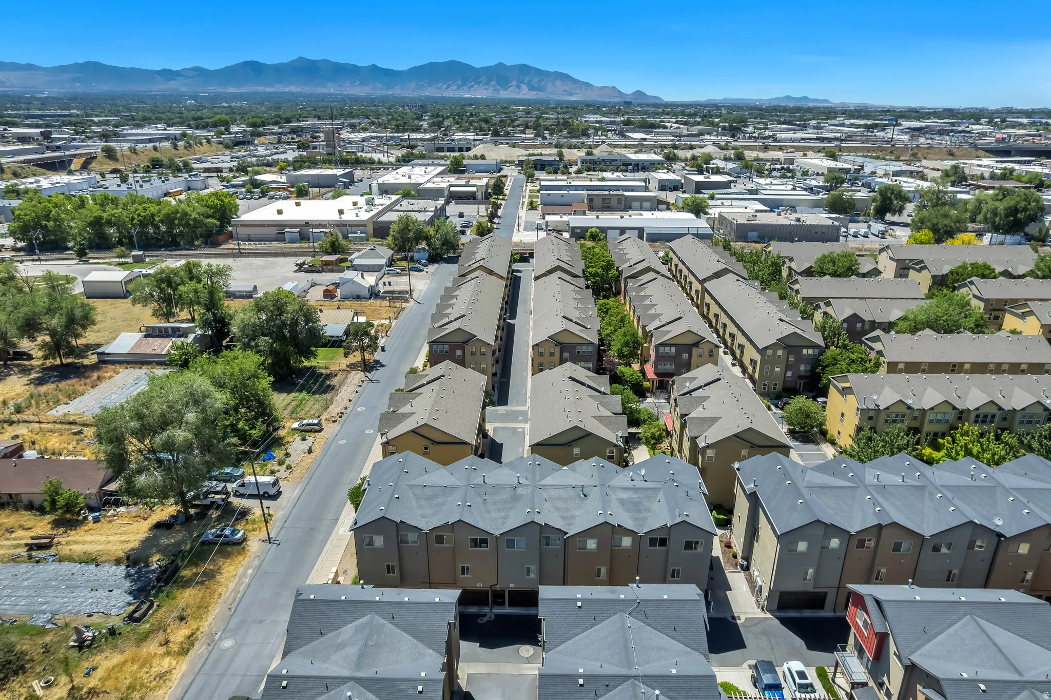 Aerial perspective of a multi-unit residential development featuring uniform architecture