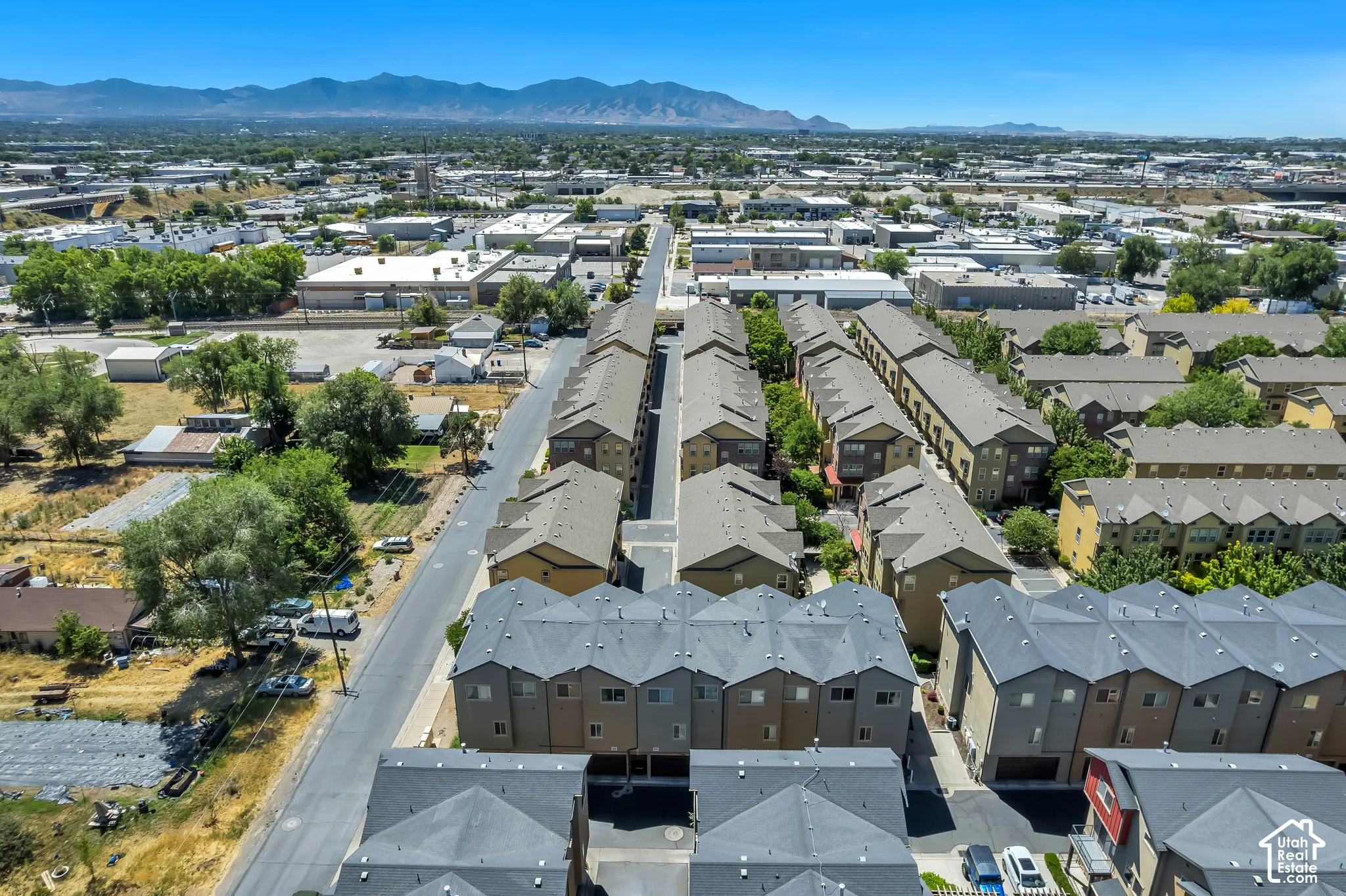 Aerial perspective of a multi-unit residential development featuring uniform architecture