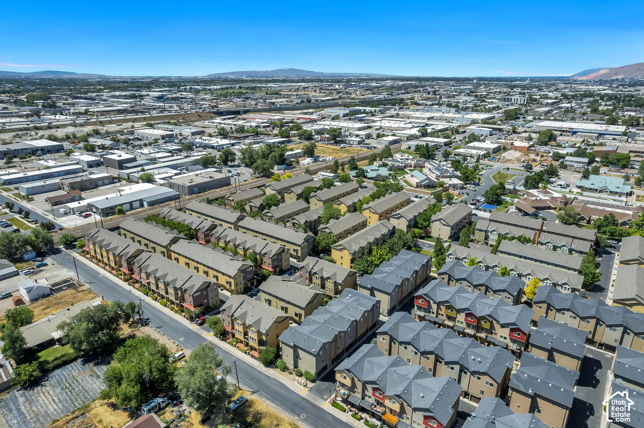 Aerial perspective showcasing a collection of multi-story residential townhomes