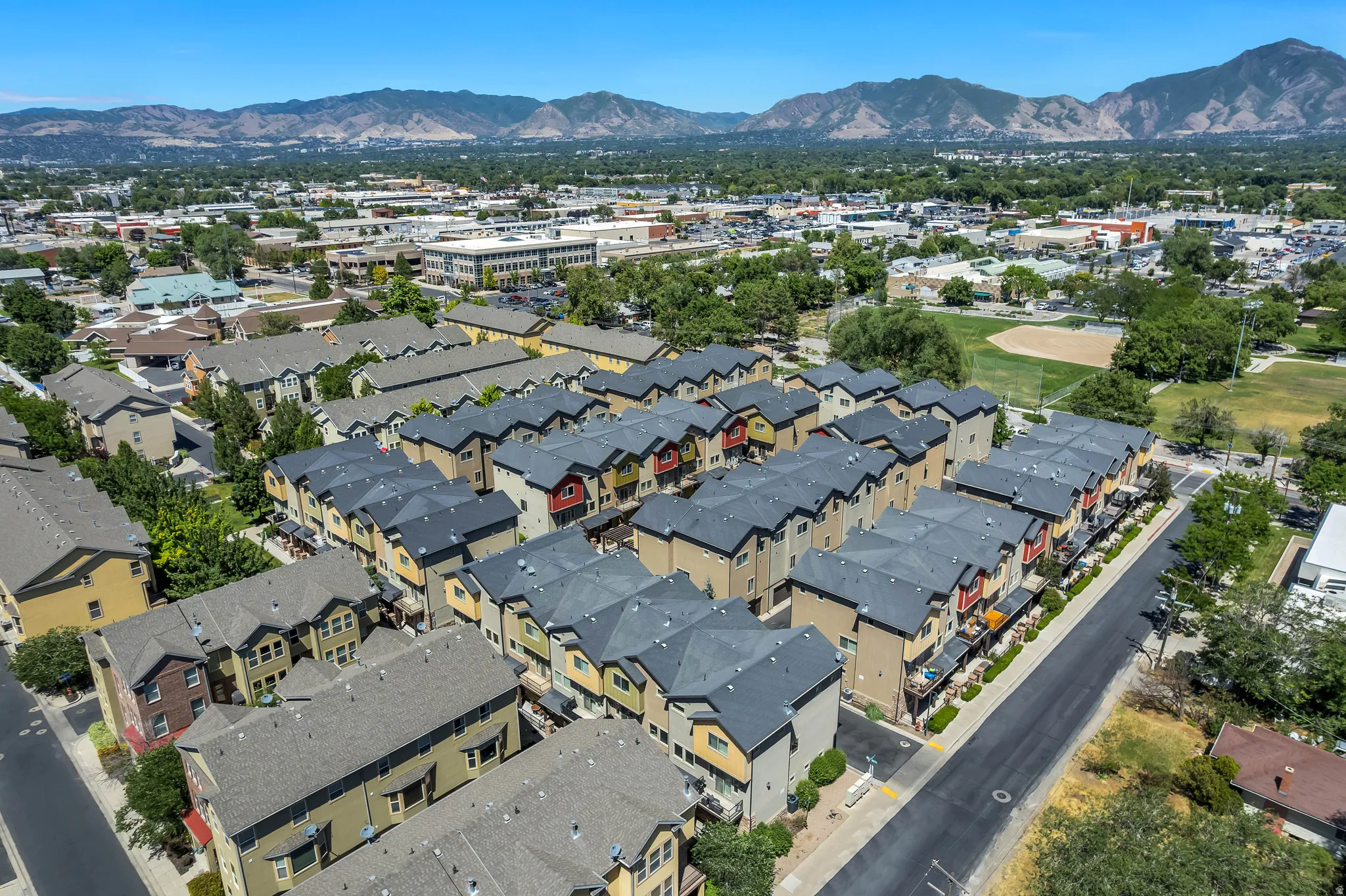 Townhome community featuring multi-story residences with varied exterior finishes