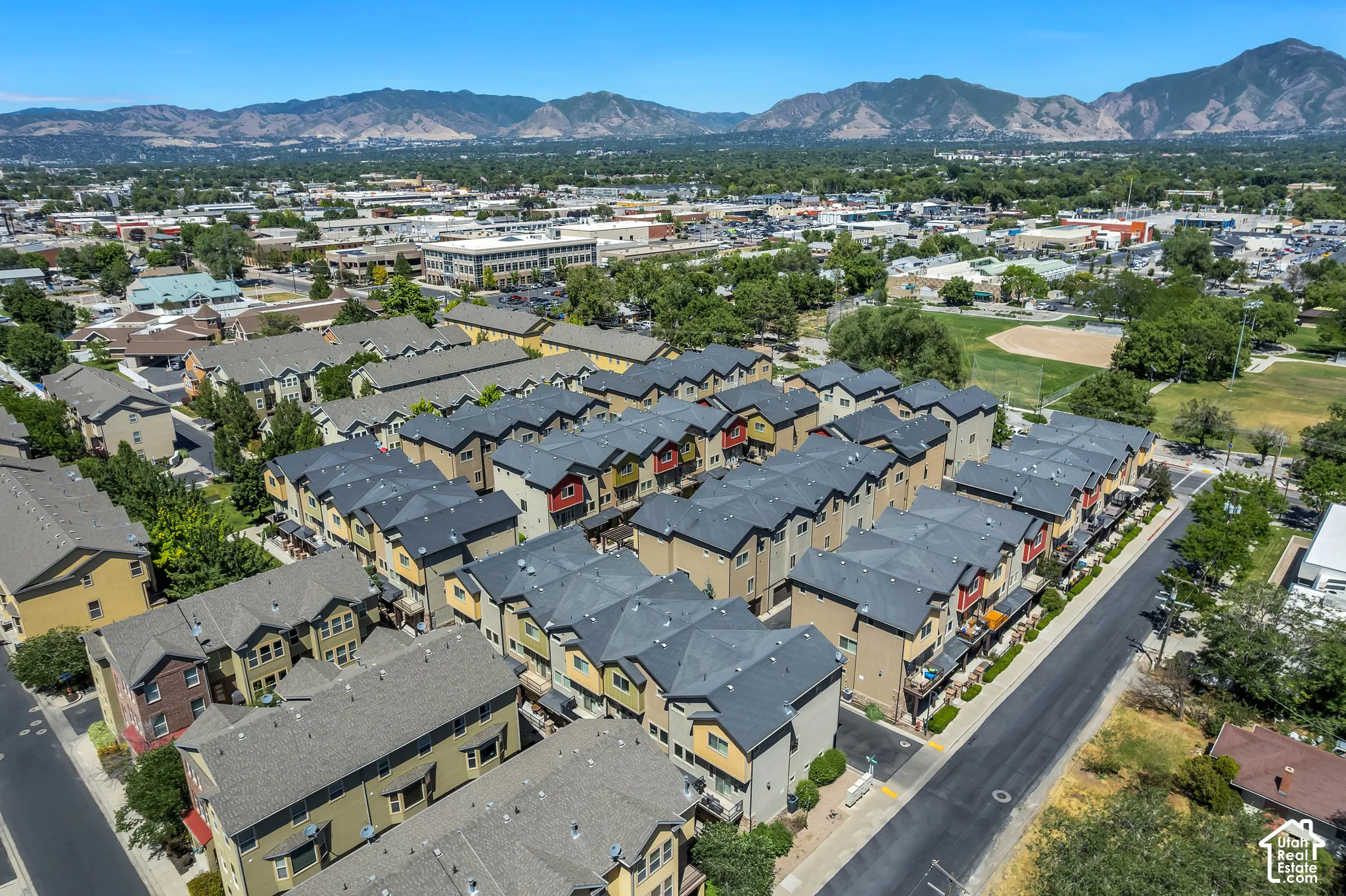 Townhome community featuring multi-story residences with varied exterior finishes