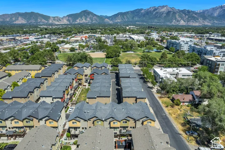 Townhome community featuring multi-story residences with private balconies and dark-toned roofing