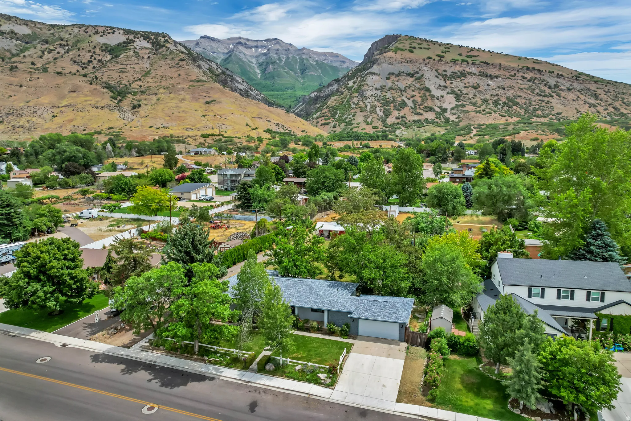 Main house and casita in back with gorgeous mountain backdrop up on high east bench in Pleasant Grove