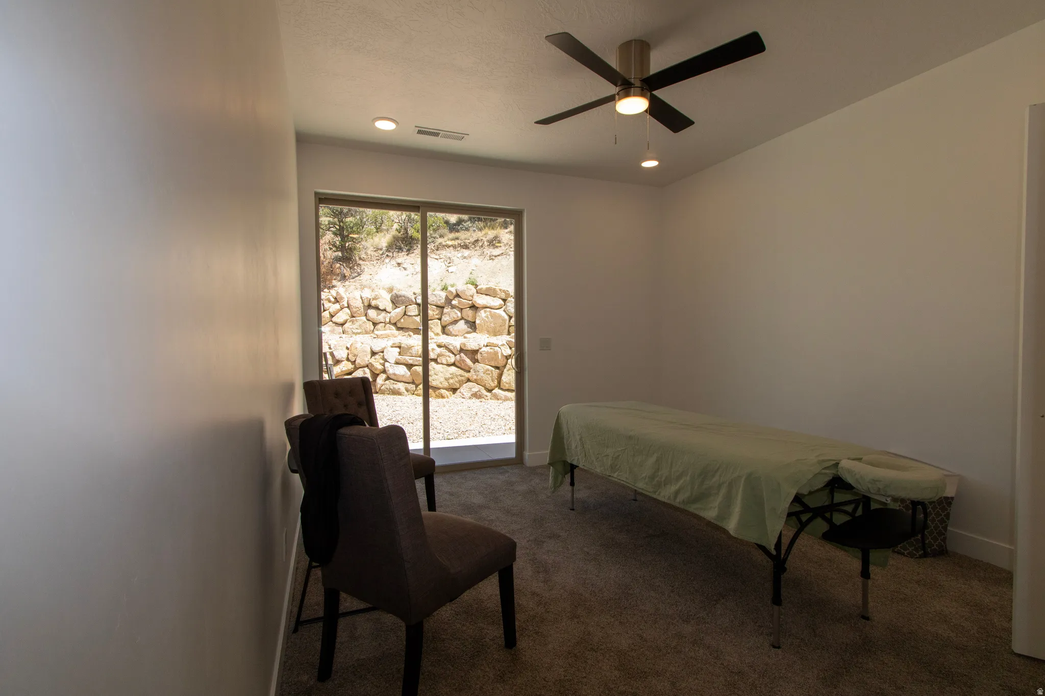 Room featuring plush carpeting, recessed lighting, and a ceiling fan with integrated lighting
