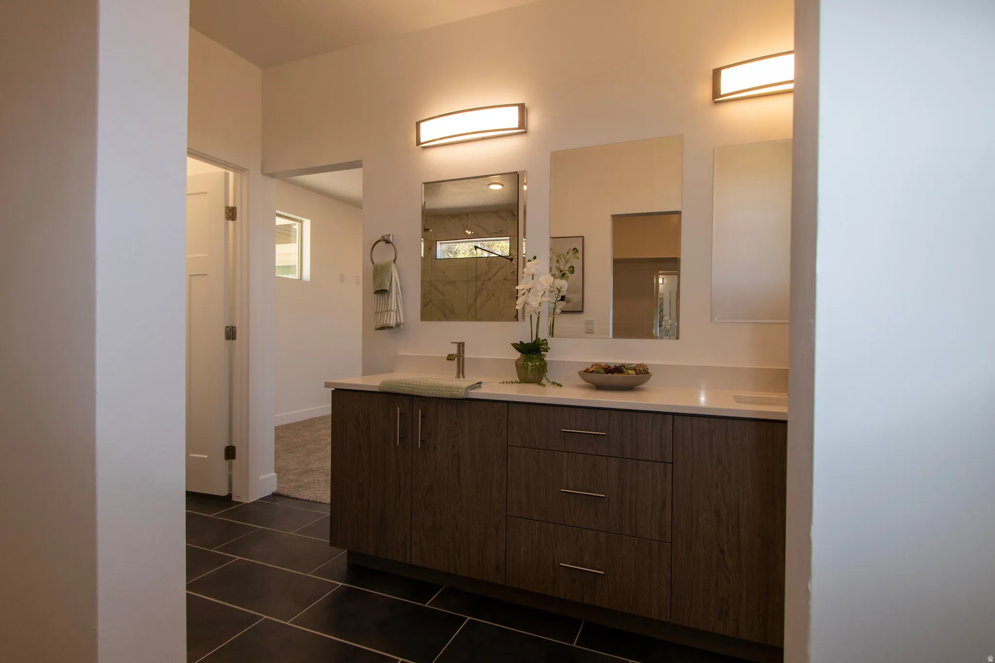 Double vanity with a white countertop and two undermount sinks