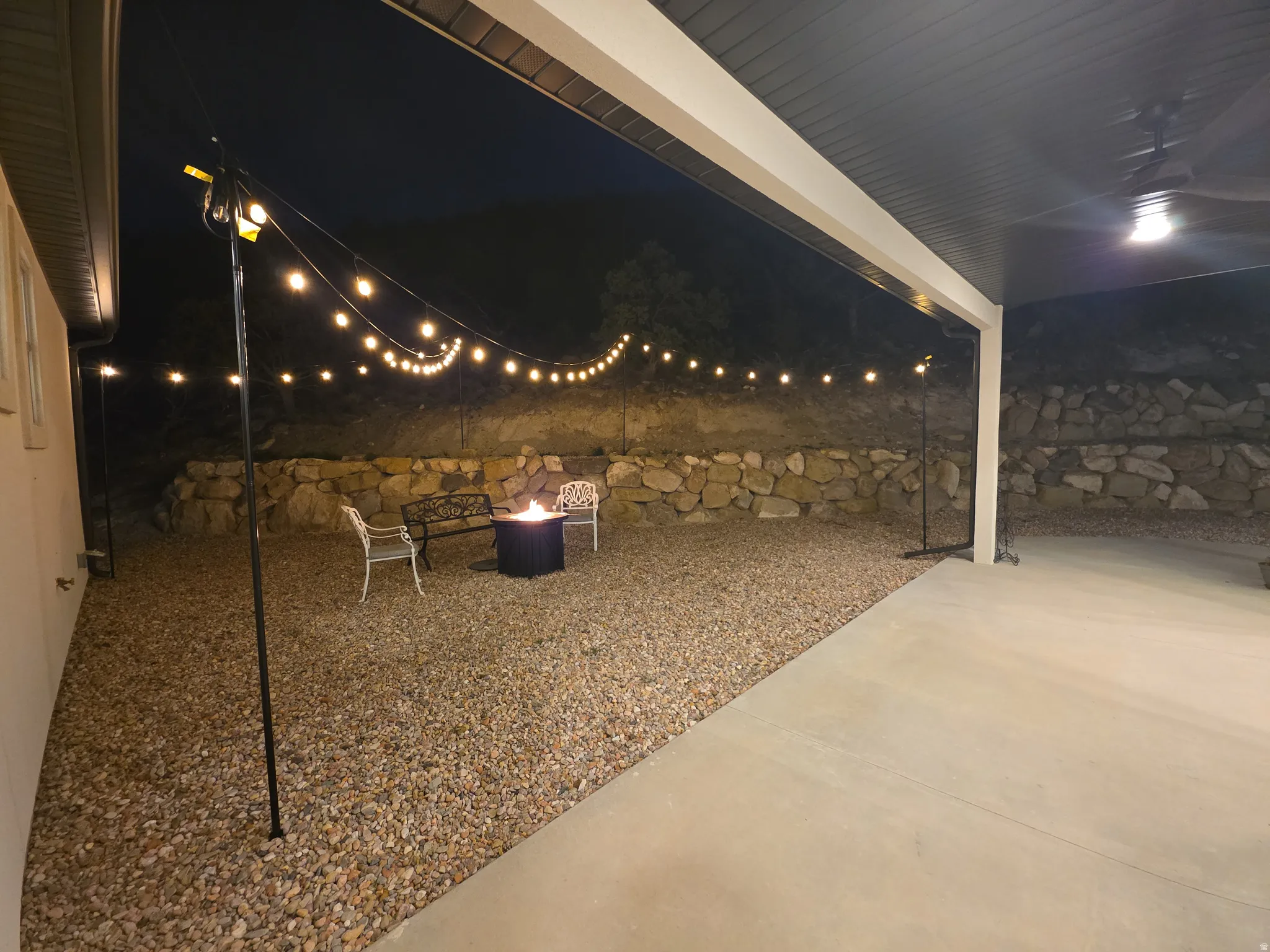 Covered patio with an exposed aggregate concrete surface
