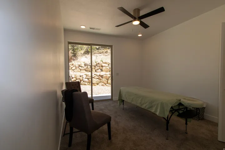 Room featuring plush carpeting, recessed lighting, and a ceiling fan with integrated lighting