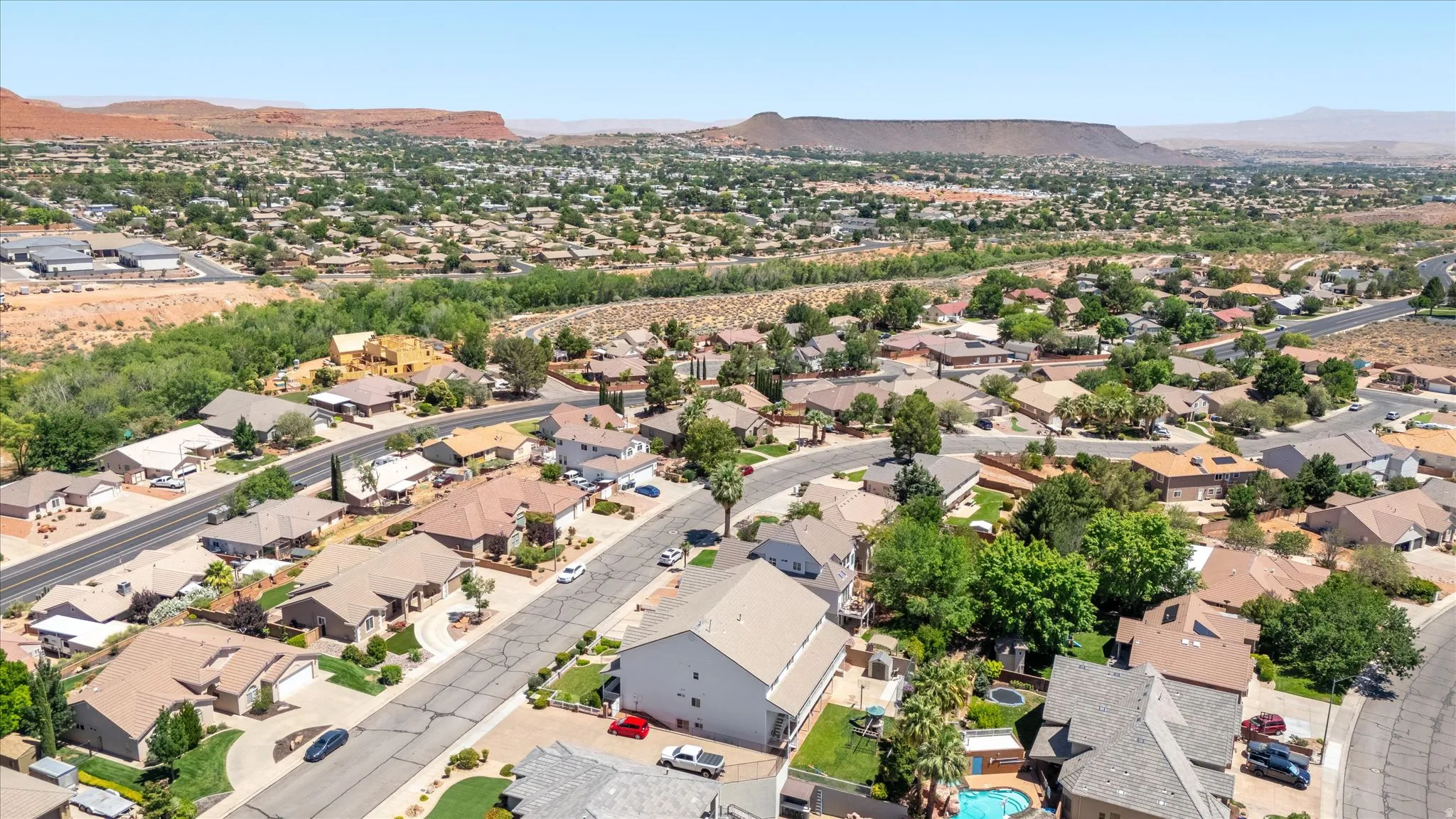 Expansive residential neighborhood featuring numerous single-family homes, mature landscaping, and tree-lined streets