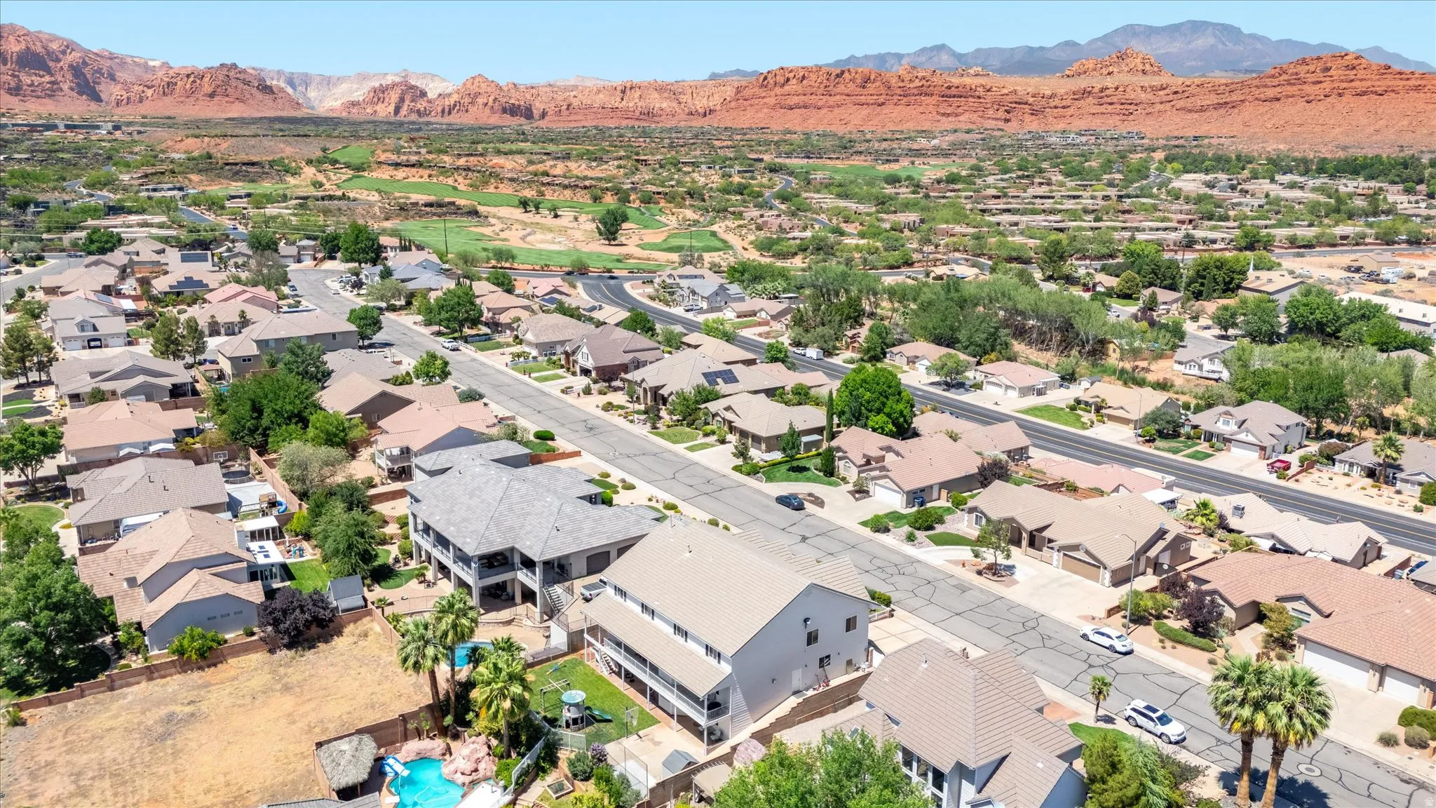 Residential neighborhood featuring varied single-family homes, mature landscaping, and paved streets