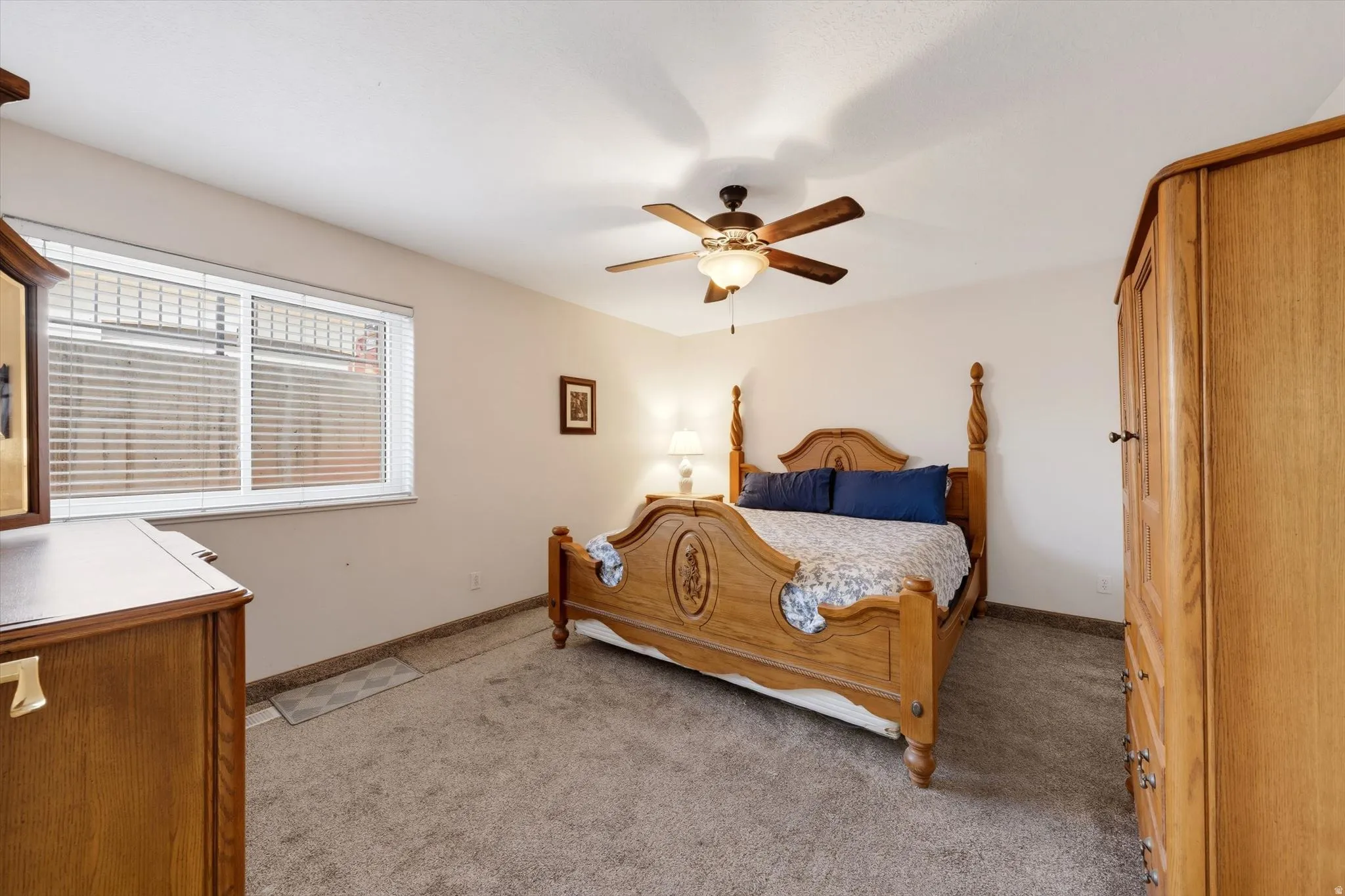 Room featuring neutral-toned carpet flooring and light-colored walls