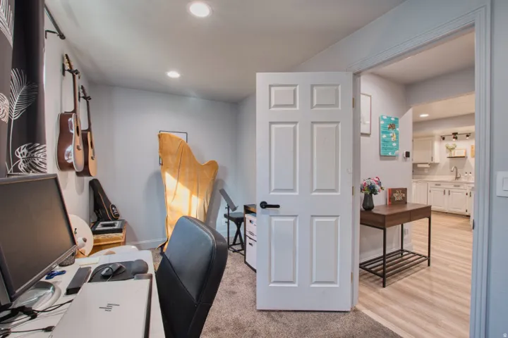 Neutral wall color and recessed lighting define this versatile interior space