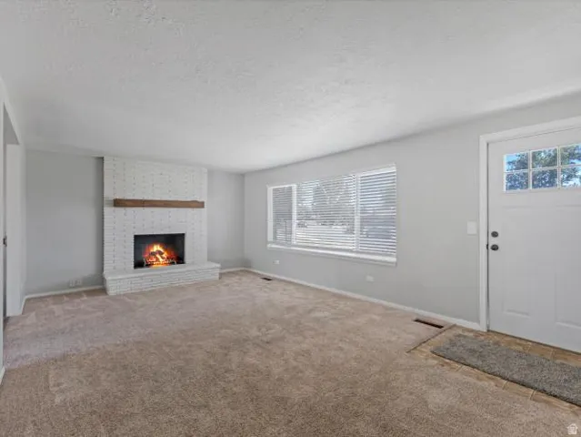 Painted brick fireplace with wood mantel