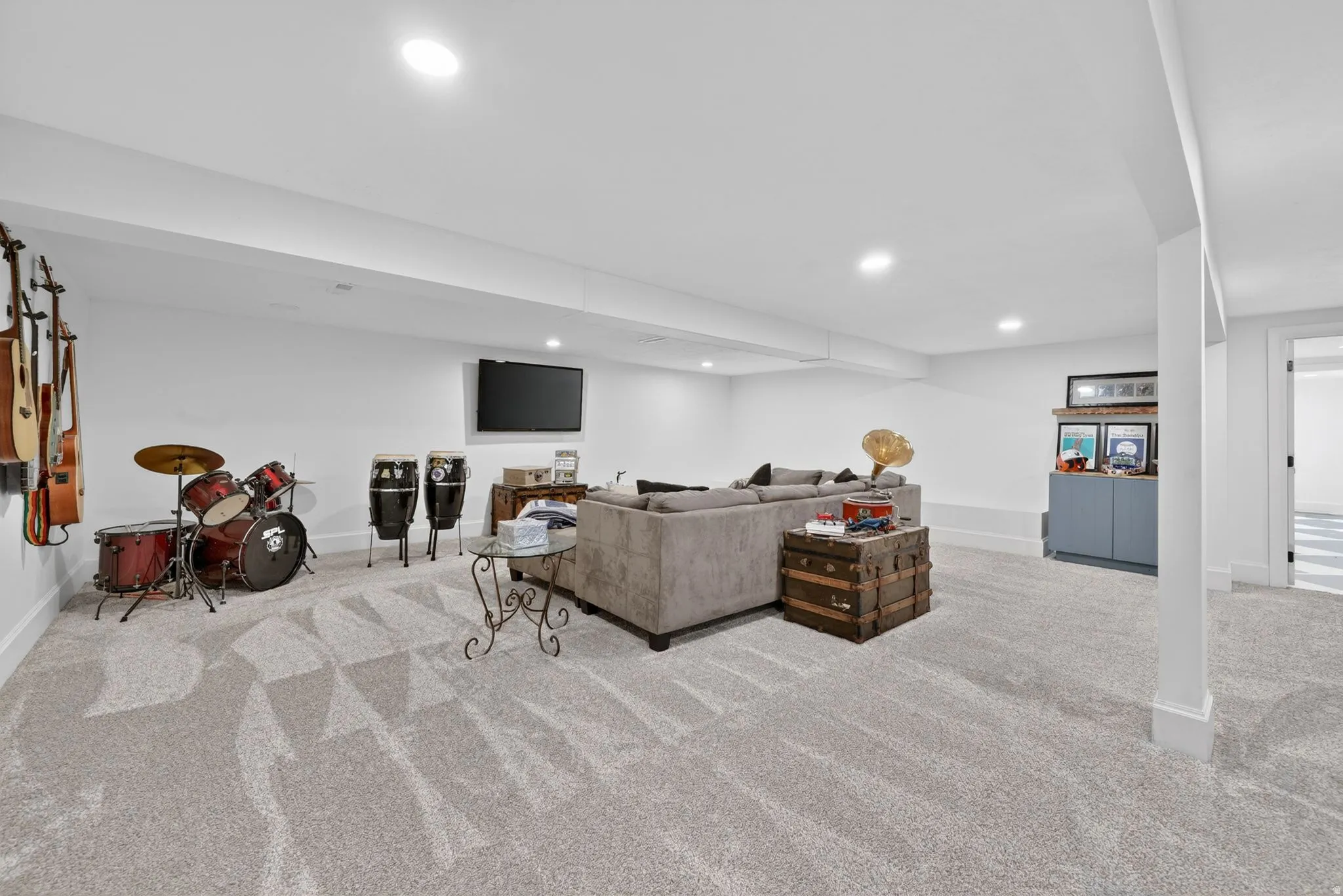 Spacious room with light-toned carpet flooring, recessed lighting, and white walls