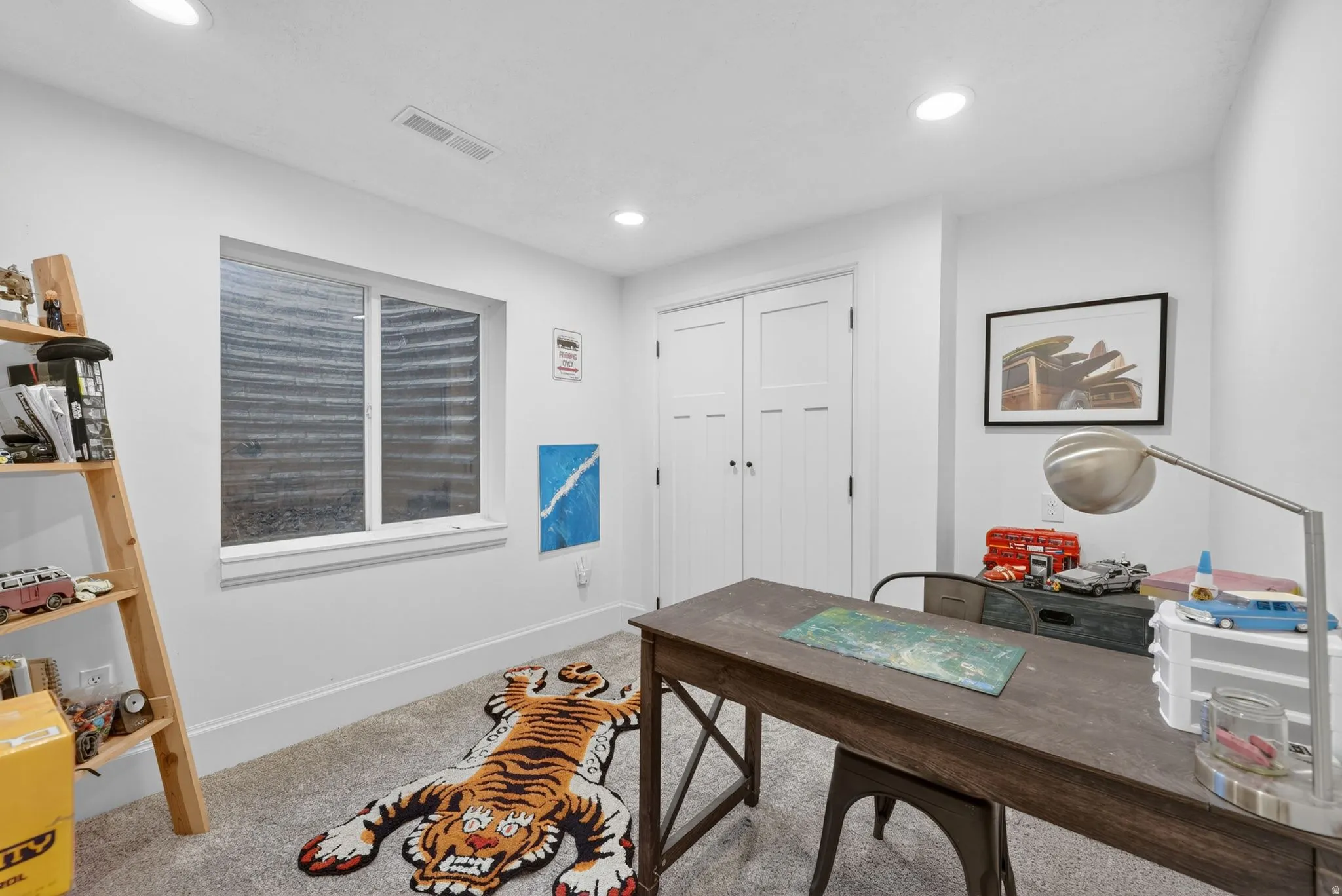 Versatile room with plush carpet flooring, recessed lighting, and a white trim window