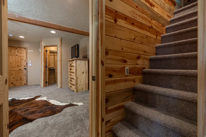 door to staircase which leads to loft