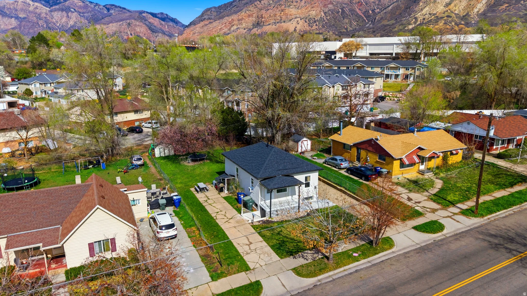 Aerial perspective of suburban area featuring a mountainous background