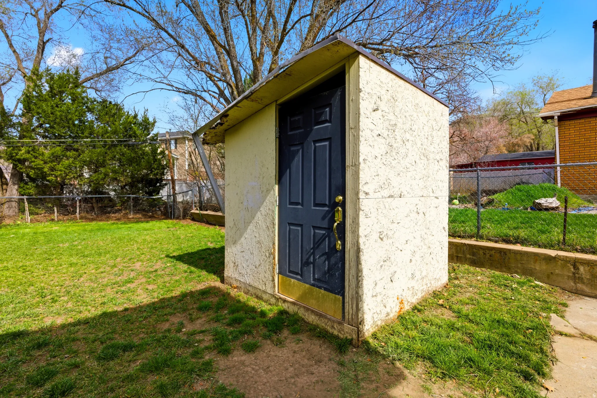 View of shed with a fenced backyard