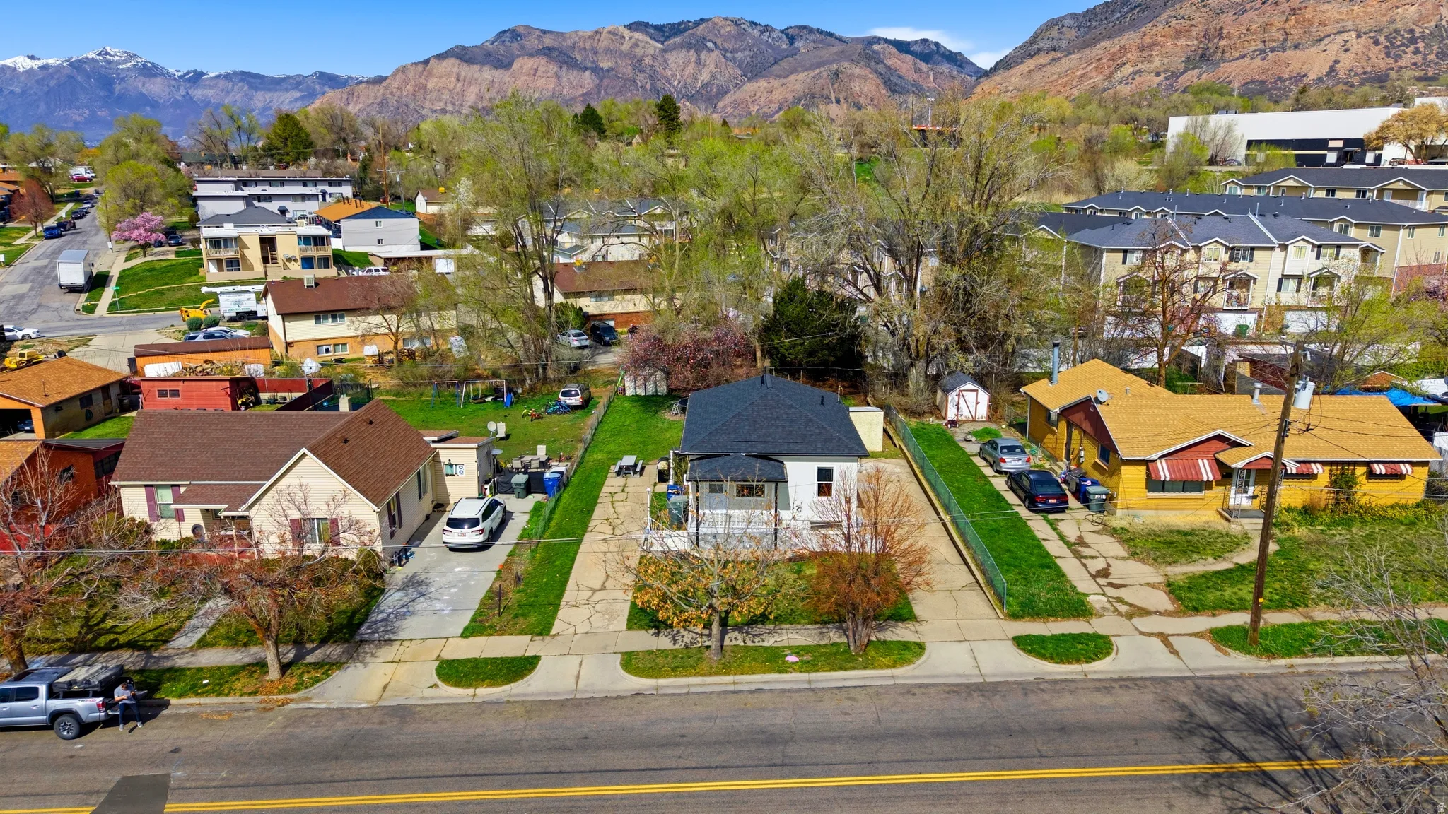 Aerial perspective of suburban area with a mountain backdrop