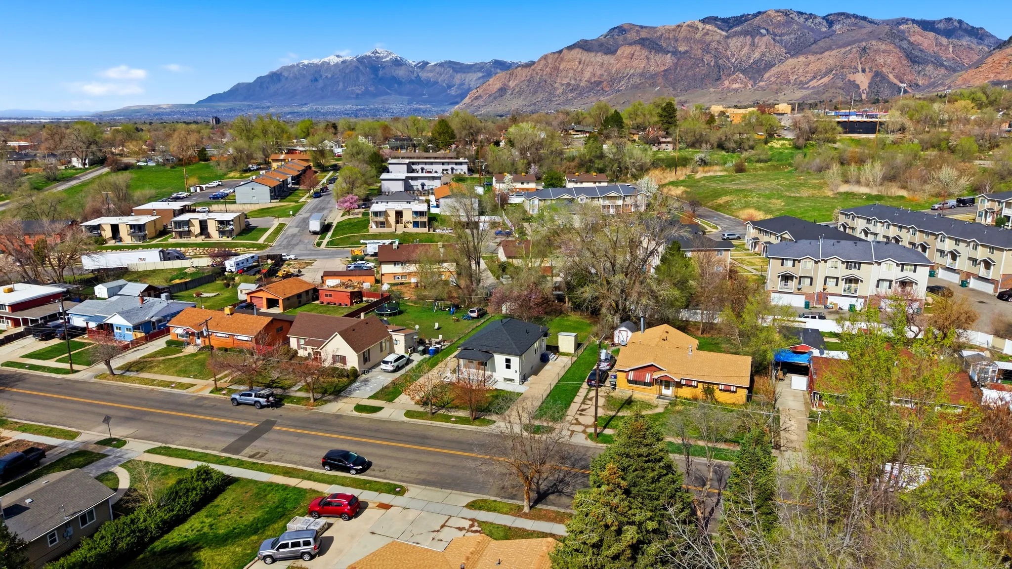 Aerial perspective of suburban area featuring a mountain backdrop