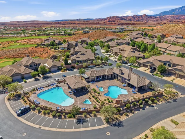 Community amenities featuring two distinct swimming pools, extensive patio areas with lounge seating, and adjacent clubhouses