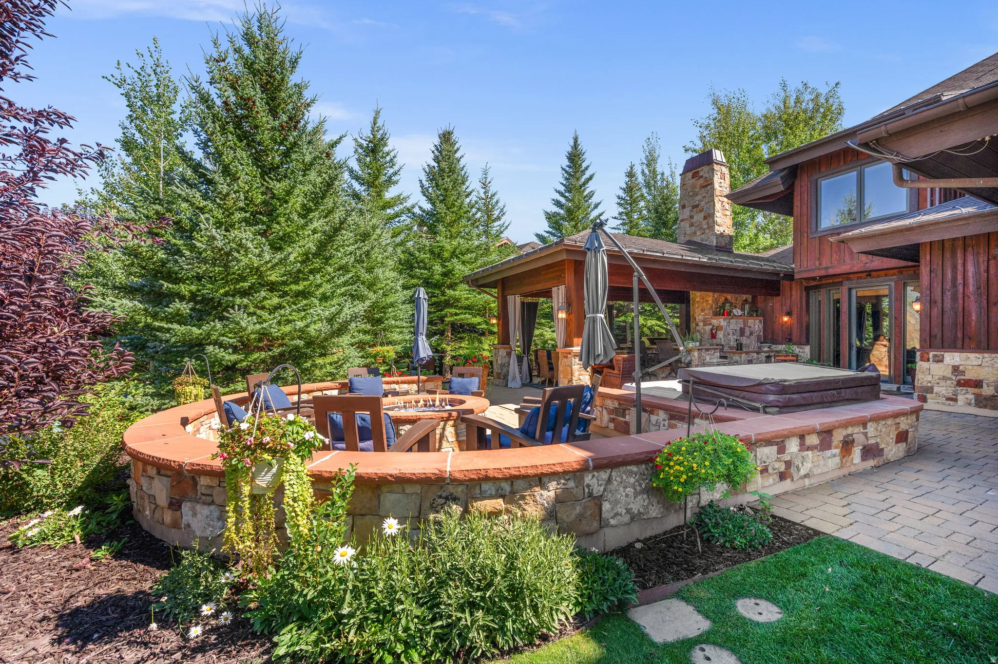 View of patio with a covered hot tub