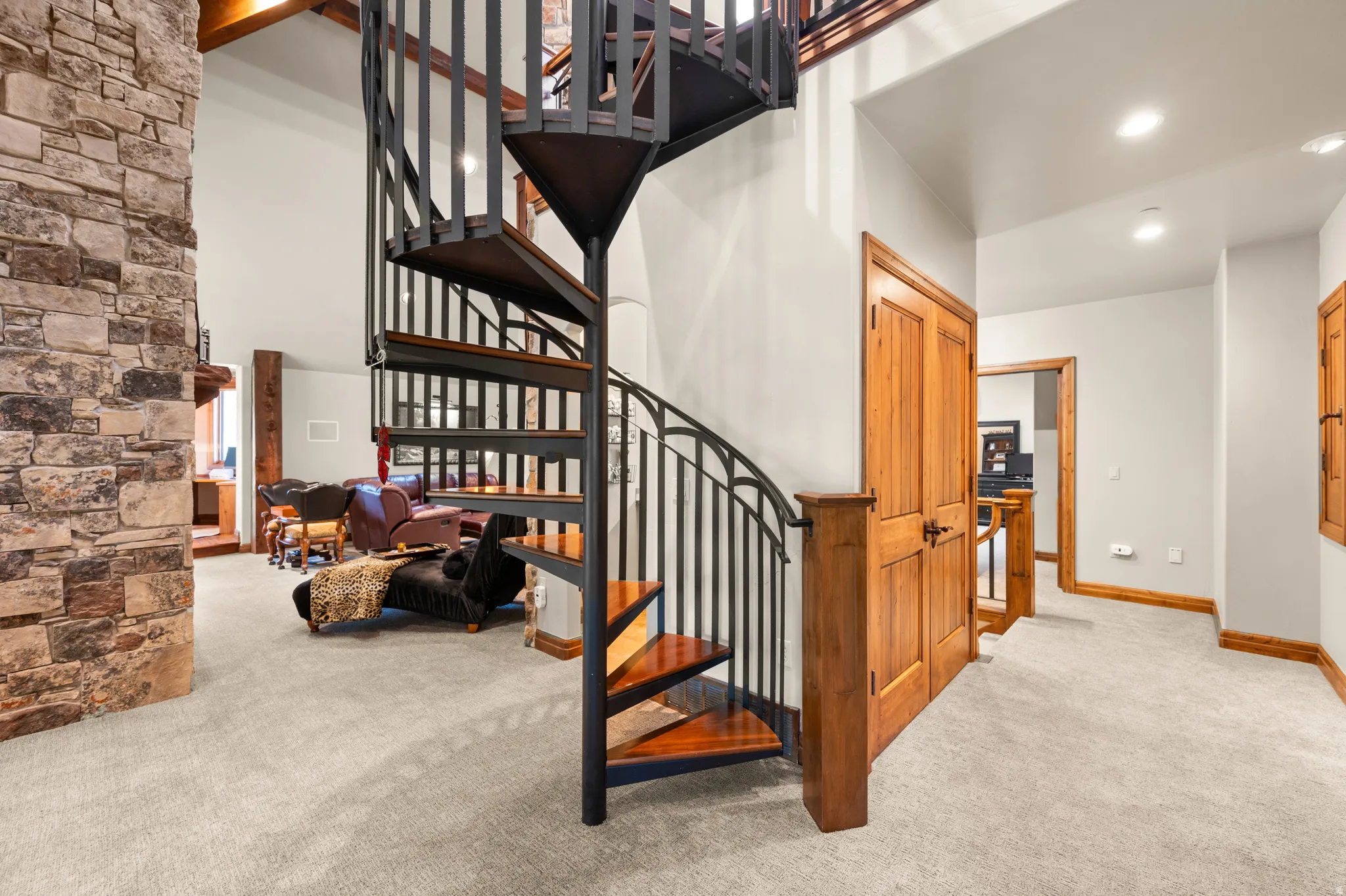 Stairway with carpet flooring, recessed lighting, and a high ceiling