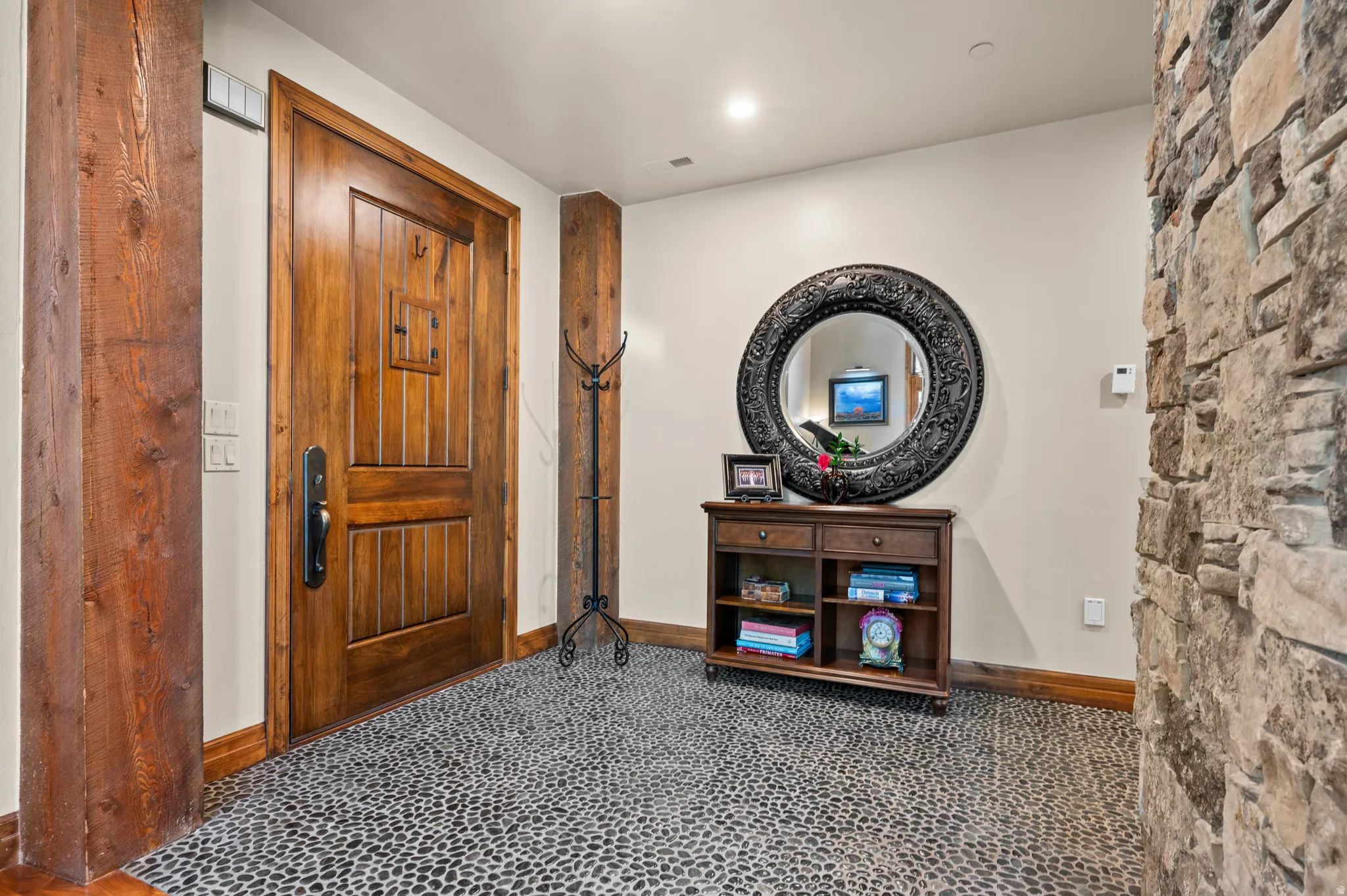 Foyer entrance with baseboards and recessed lighting