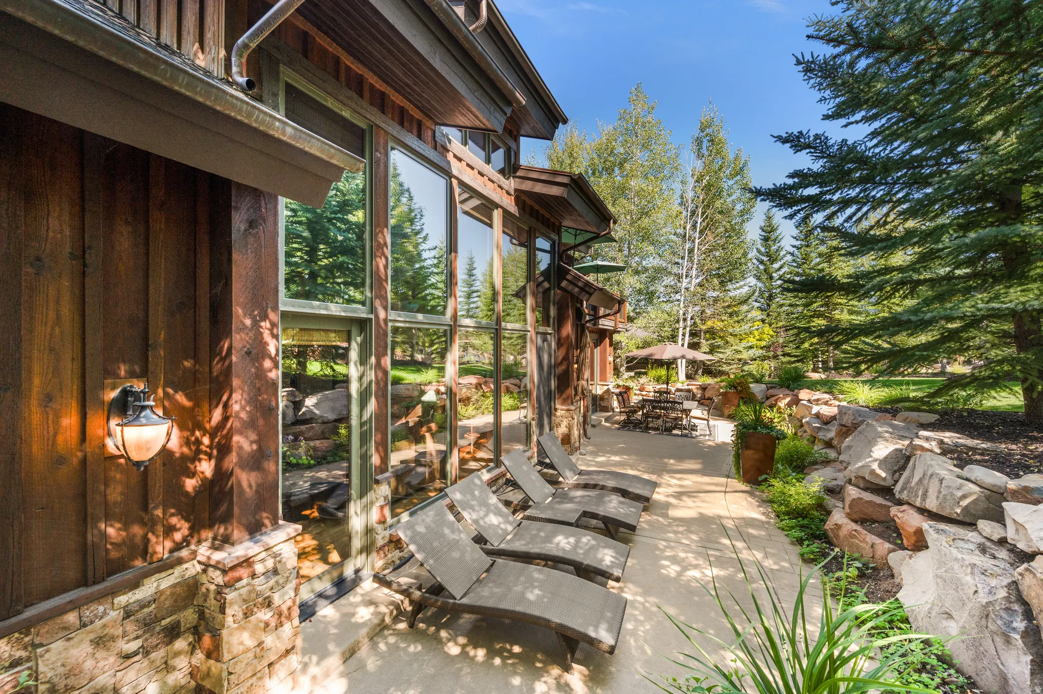 View of patio / terrace with outdoor dining space and a sunroom