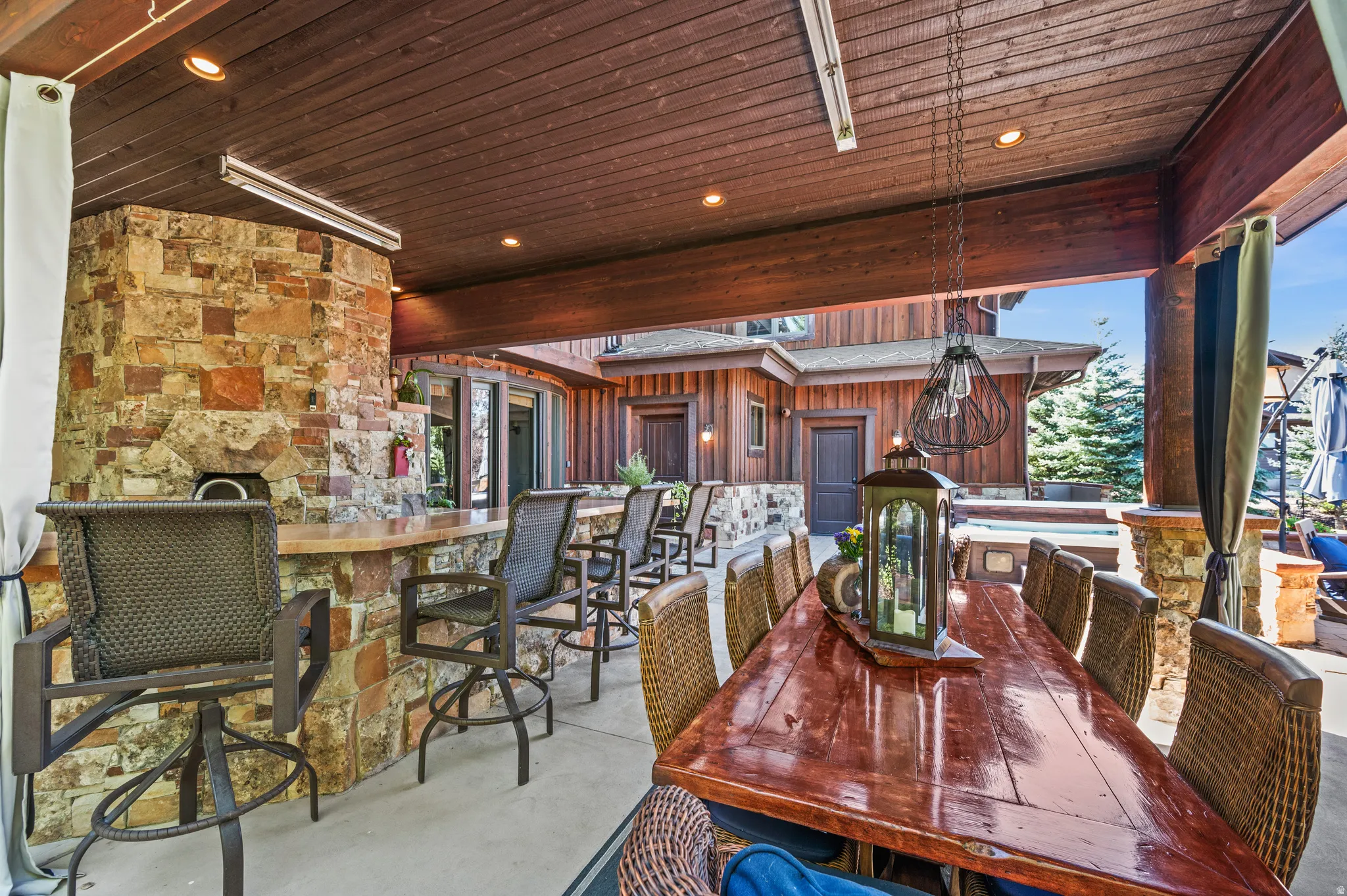 View of patio featuring an outdoor bar and dining area