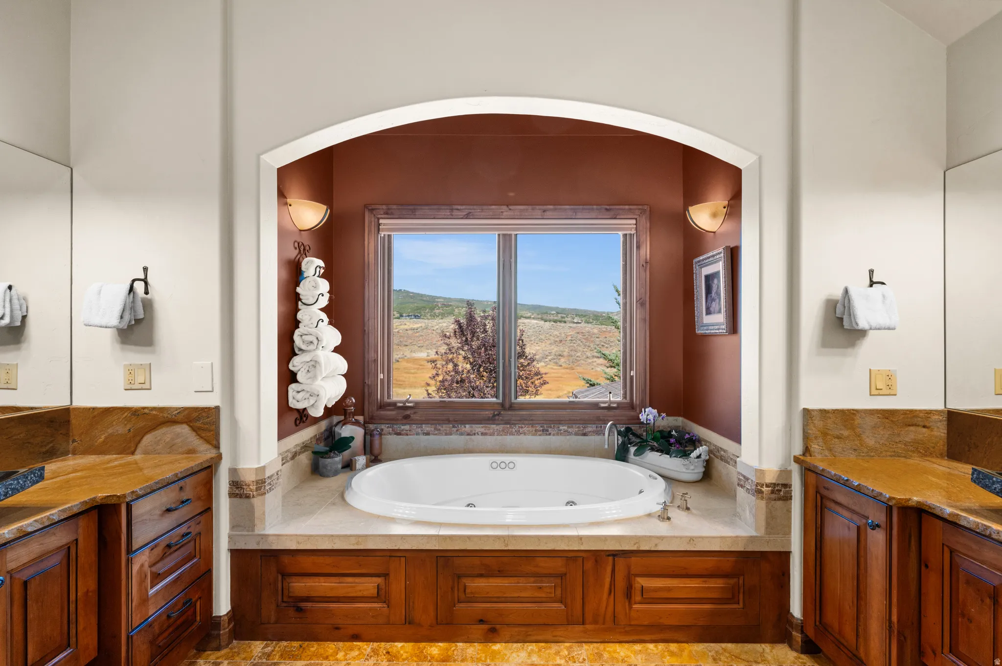 Full bathroom with vanity and a tub with jets