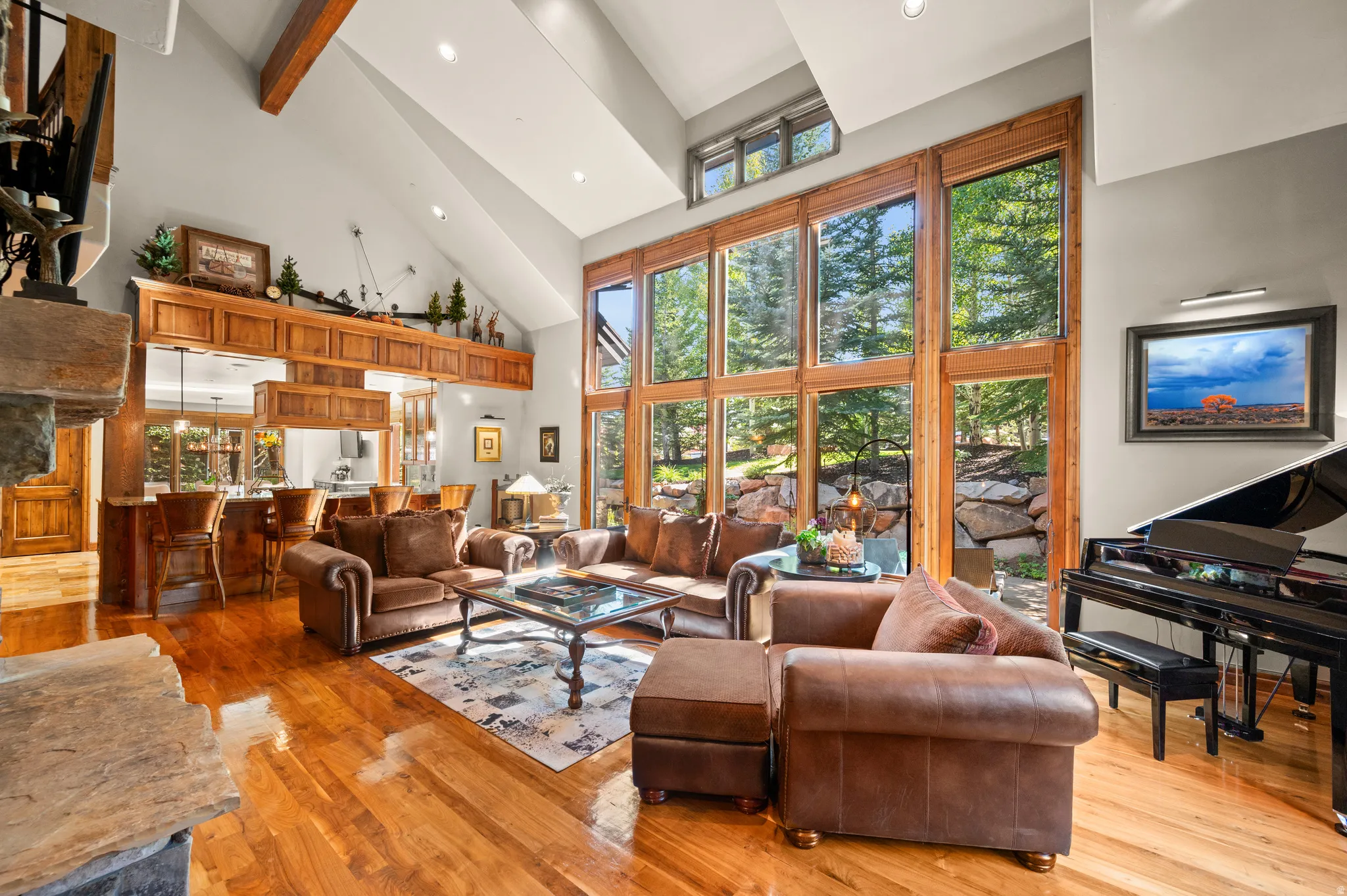 Living area with recessed lighting, light wood-style flooring, and vaulted ceiling