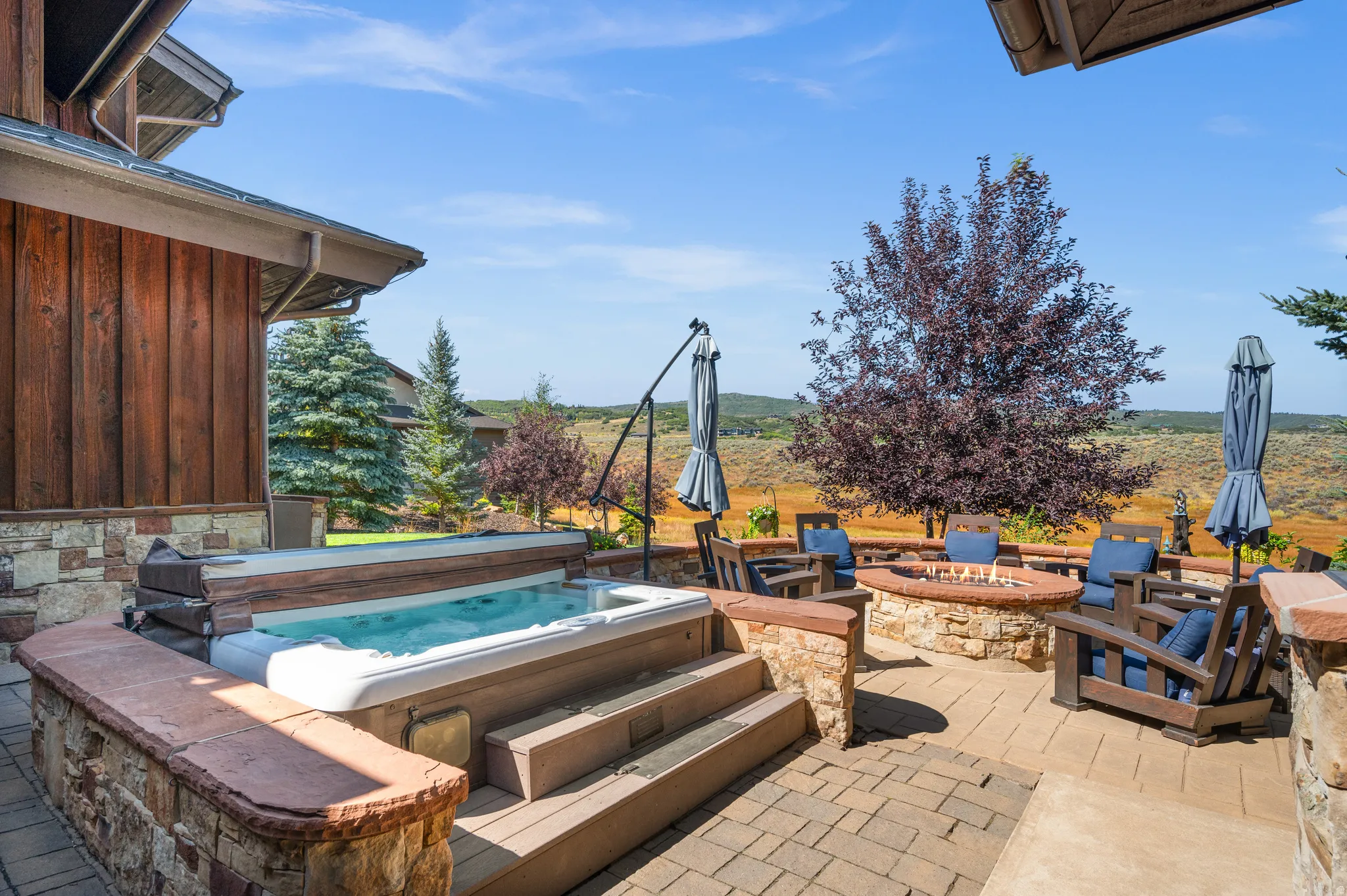View of patio / terrace featuring a fire pit and a grill