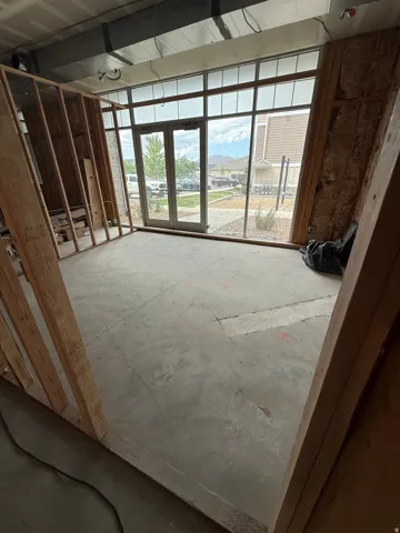 Expansive storefront featuring full-height glass panels and a double-door entryway