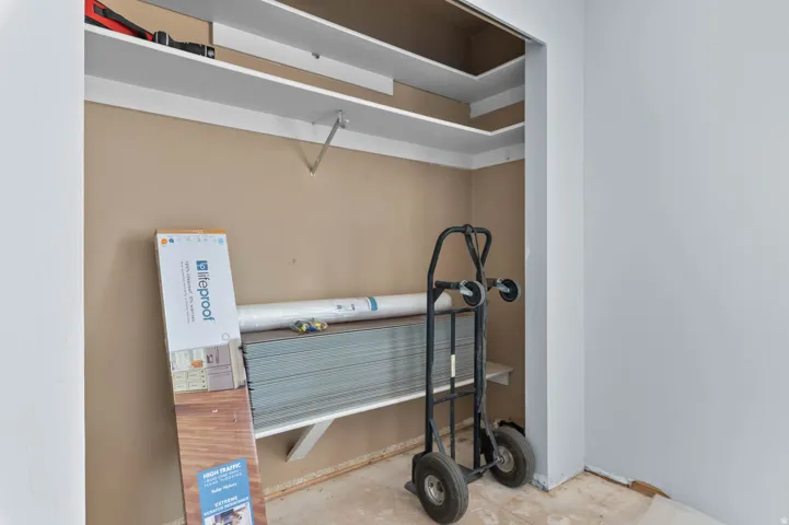 Storage closet with built-in shelving, providing vertical organization