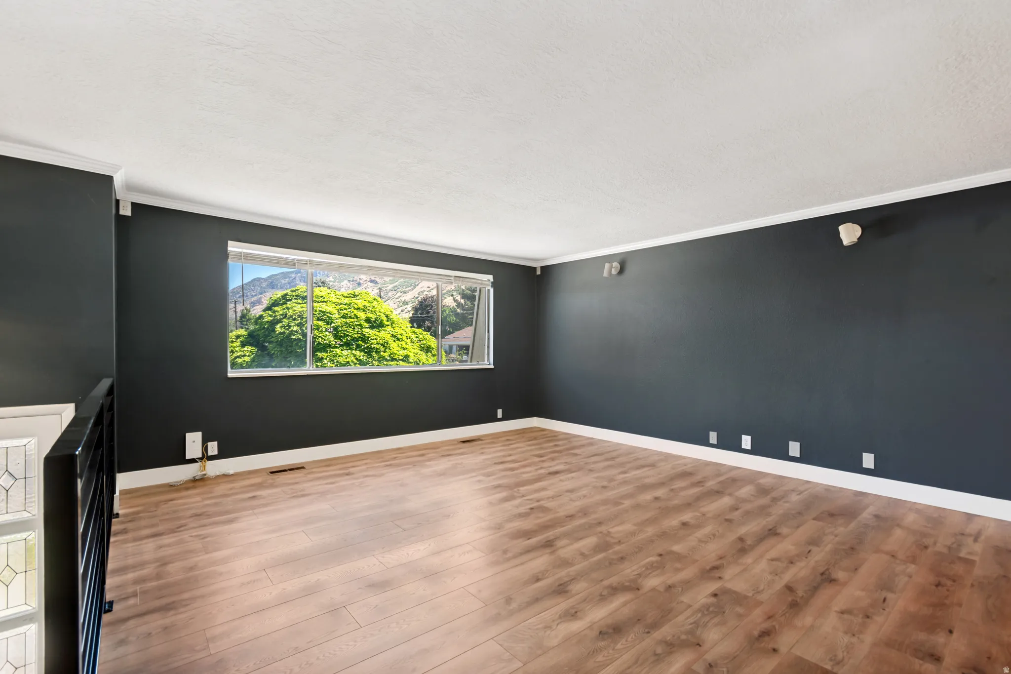 Living room walls are more navy than photo shown