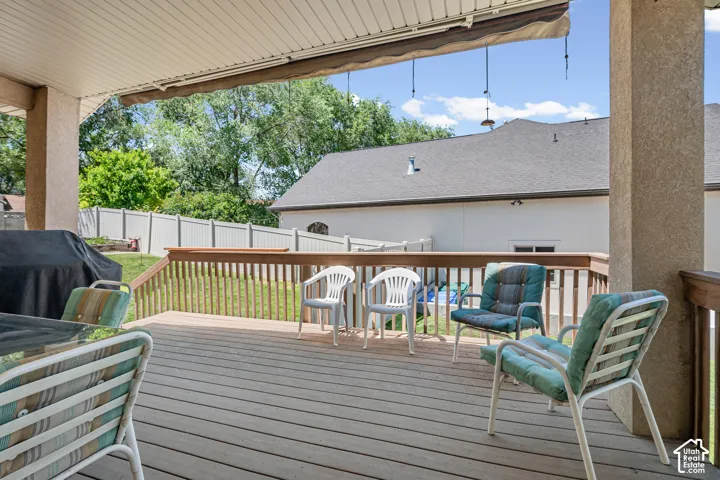 Covered exterior deck featuring Trex flooring