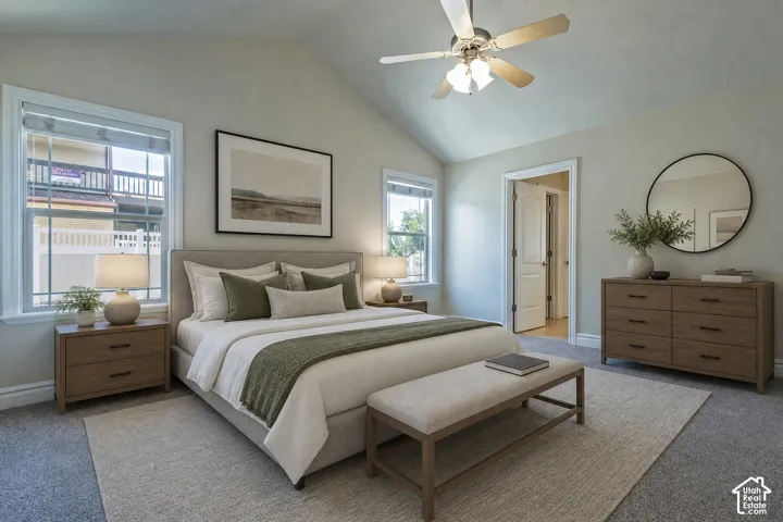 Vaulted ceilings enhance this carpeted room featuring a ceiling fan with light fixture, two windows, and a doorway