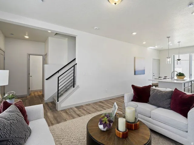 Open-concept living area with wood-finish flooring