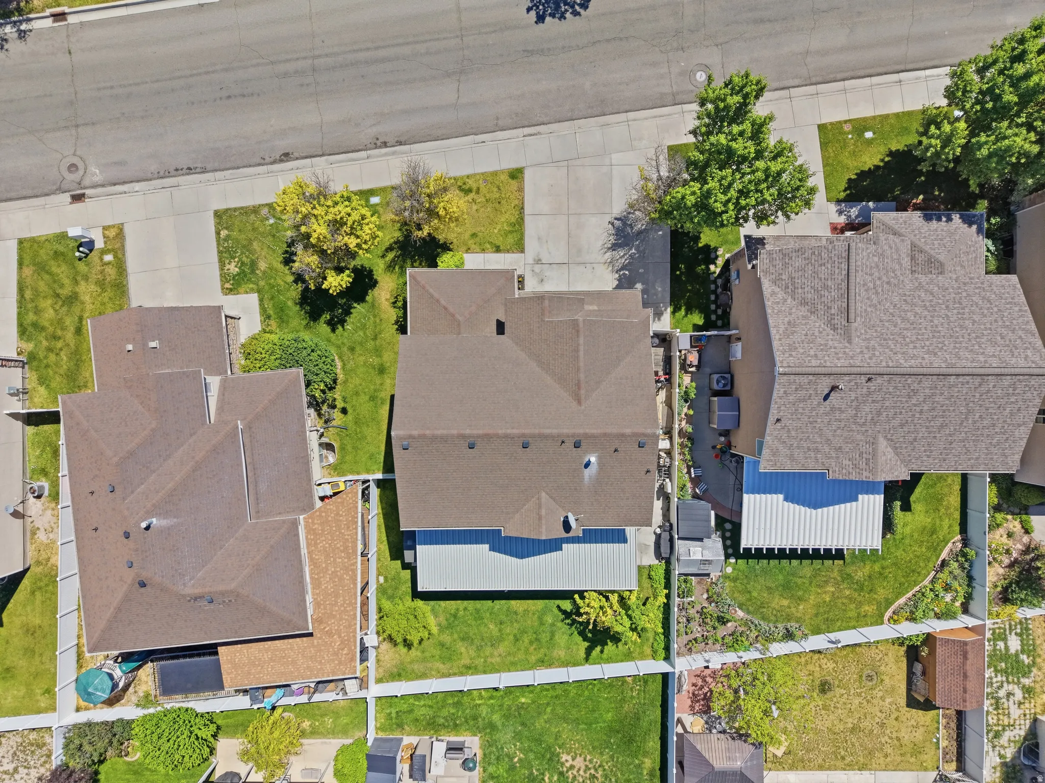 Aerial perspective showcasing a residential property with a multi-gabled roofline