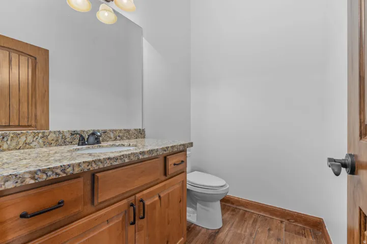 Vanity featuring a built-in sink, dark bronze faucet, and a light-toned countertop