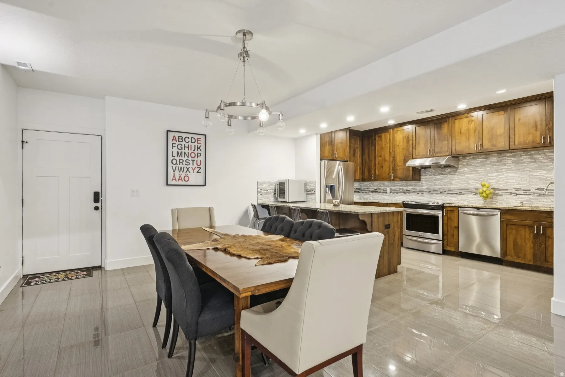 Dining space featuring hanging lights and baseboards