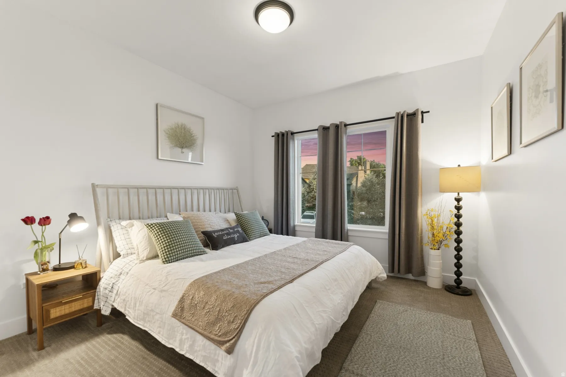 Bedroom featuring carpet floors and baseboards
