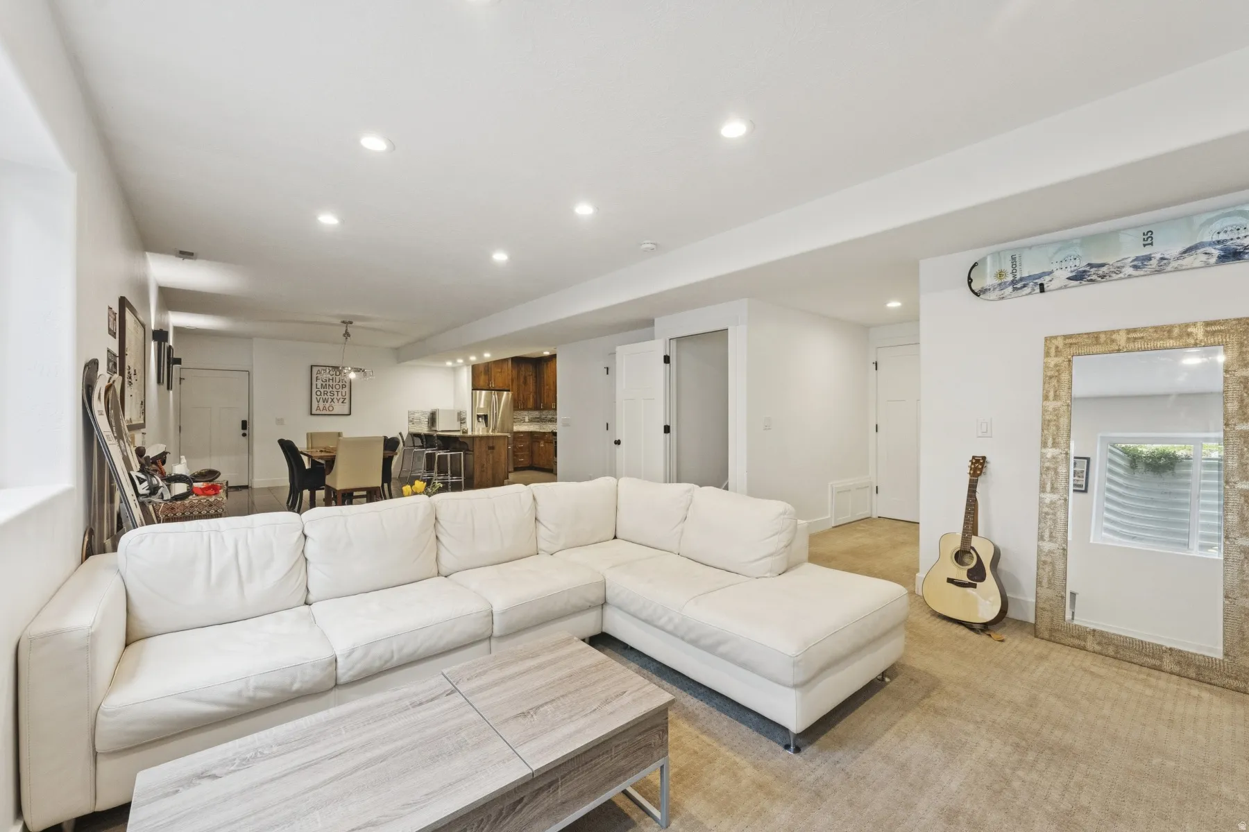 Living area featuring recessed lighting and light carpet