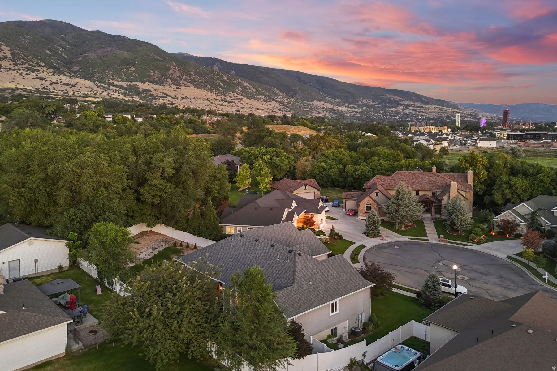 Aerial perspective of suburban area with a mountainous background